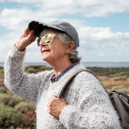 senior-woman-hiking-in-a-rugged-coastal-landscape-2026-03-11-00-53-54-utc