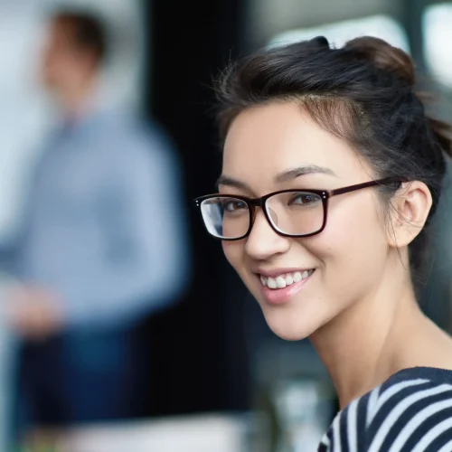 smiling-woman-with-glasses-in-workplace-setting-2026-03-25-04-42-12-utc